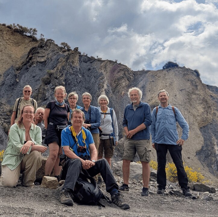 Field excursion group in a rocky landscape