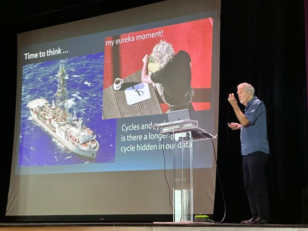 Professor Dorrik Stow on stage presenting a lecture on cycles in ocean drilling data